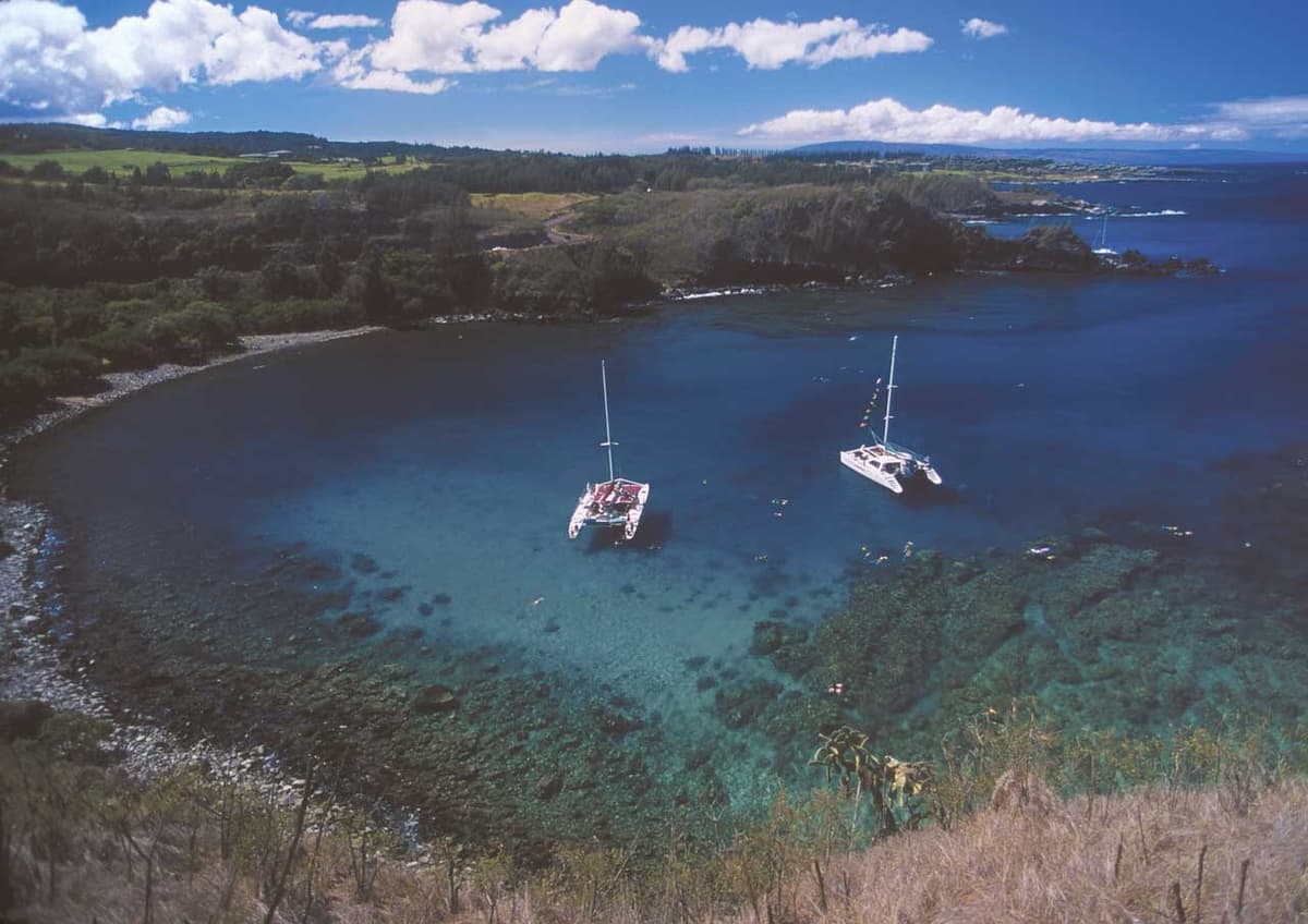 Honolua Bay from above, with boats anchored in the marine reserve